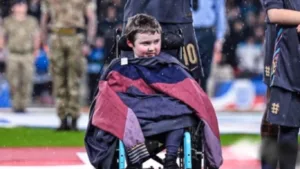 Jude Bellingham, In Rain At Wembley, Puts His Coat On Crippled Fan